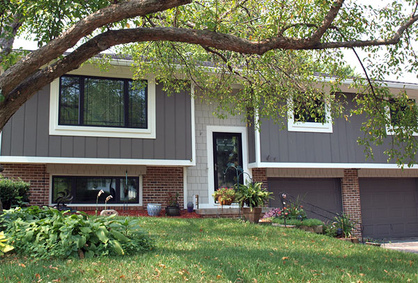 House with new cedar siding painted gray with white trim