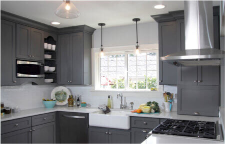 Kitchen remodel with gray cabinets and white farmhouse sink