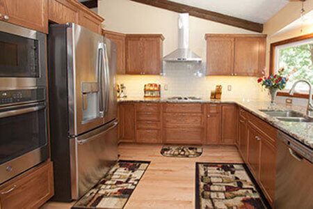 Kitchen remodel with oak cabinets, granite countertops and large picture window