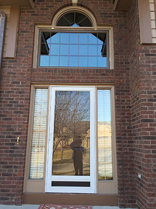 Before photo of a replacement entry door in West Omaha house
