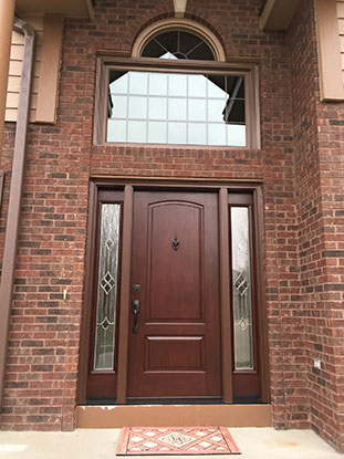 Omaha custom wood entry door with decorative glass sidelights