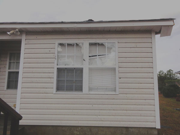 Hail damage to windows on house